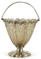 Henry Wilkinson & Co, Victorian silver pedestal basket pierced with foliage, with swing handle and