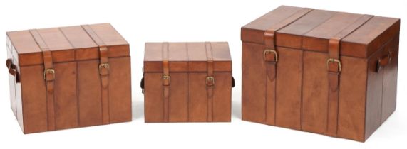 Graduated set of three brown leather trunks, the largest 46cm H x 61cm W x 46cm D : For further