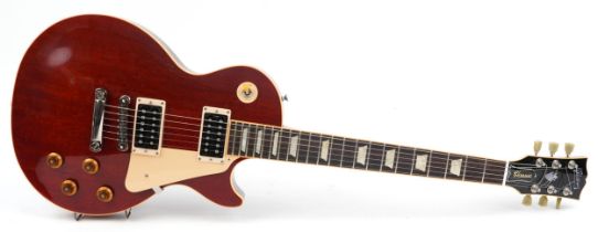 Gibson Classic Les Paul electric guitar with mother of pearl inlay housed in a Gibson protective