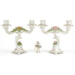 Dresden porcelain comprising a pair of floral encrusted two branch candelabras and a lace