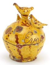 Early 19th century Ewenny pottery money box surmounted with birds, incised Evan Evance, dated