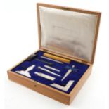 Oak cased masonic set with silver plated compass with ebony gavel and folding wooden ruler, 42cm x