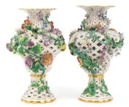 Meissen, a near pair of large German reticulated porcelain floral encrusted vases, blue crossed