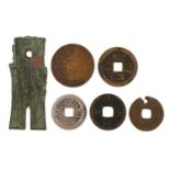 Six antique Chinese coins and spade money including four cash coins, the largest 6cm in length : For