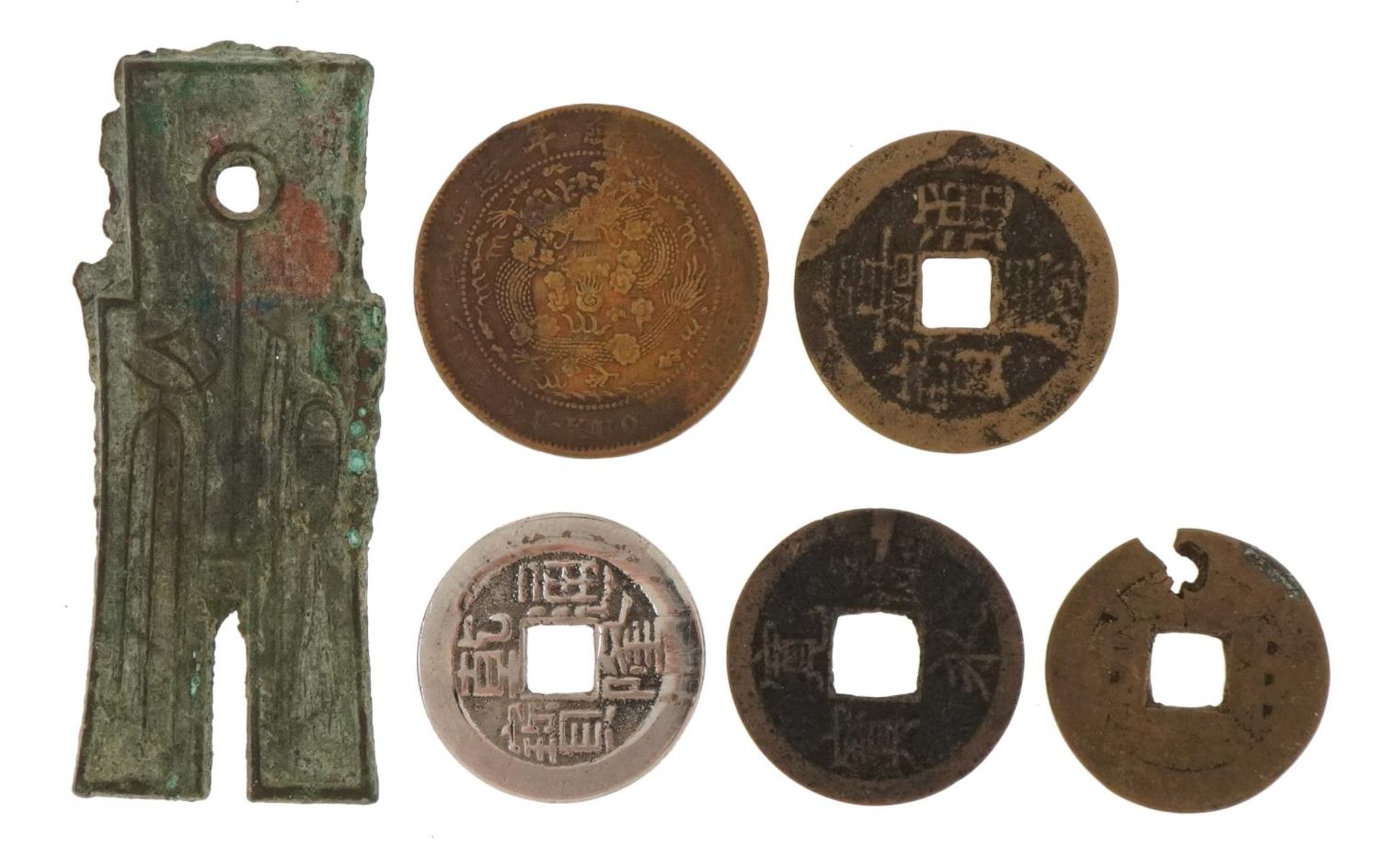 Six antique Chinese coins and spade money including four cash coins, the largest 6cm in length : For