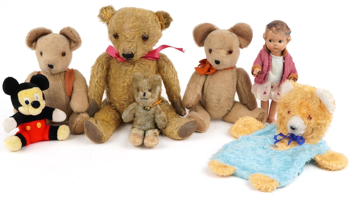 Vintage and later teddy bears and a composite doll including a large golden teddy bear with