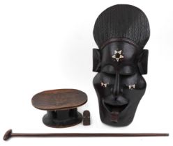 Tribal interest wood carvings including large face mask with bone inlay and stool, the largest