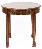 Sheraton Revival mahogany centre table carved with urns, flower heads and foliage, Druce & Co Ltd of