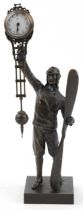 Patinated bronze military interest mystery clock in the form of a pilot, 37cm high : For further