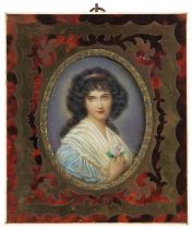 Oval portrait miniature of a young female housed in a red tortoiseshell frame with brass foliate