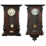 Two Vienna wall clocks with enamelled dials having Roman numerals, the largest 72.5cm high : For