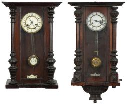 Two Vienna wall clocks with enamelled dials having Roman numerals, the largest 72.5cm high : For