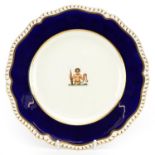 Early 19th century armorial plate with cobalt blue border, possibly Daniel or Chamberlain's