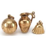Three 9ct gold charms comprising football, jug and bell, the largest 1.3cm high, total 1.9g : For