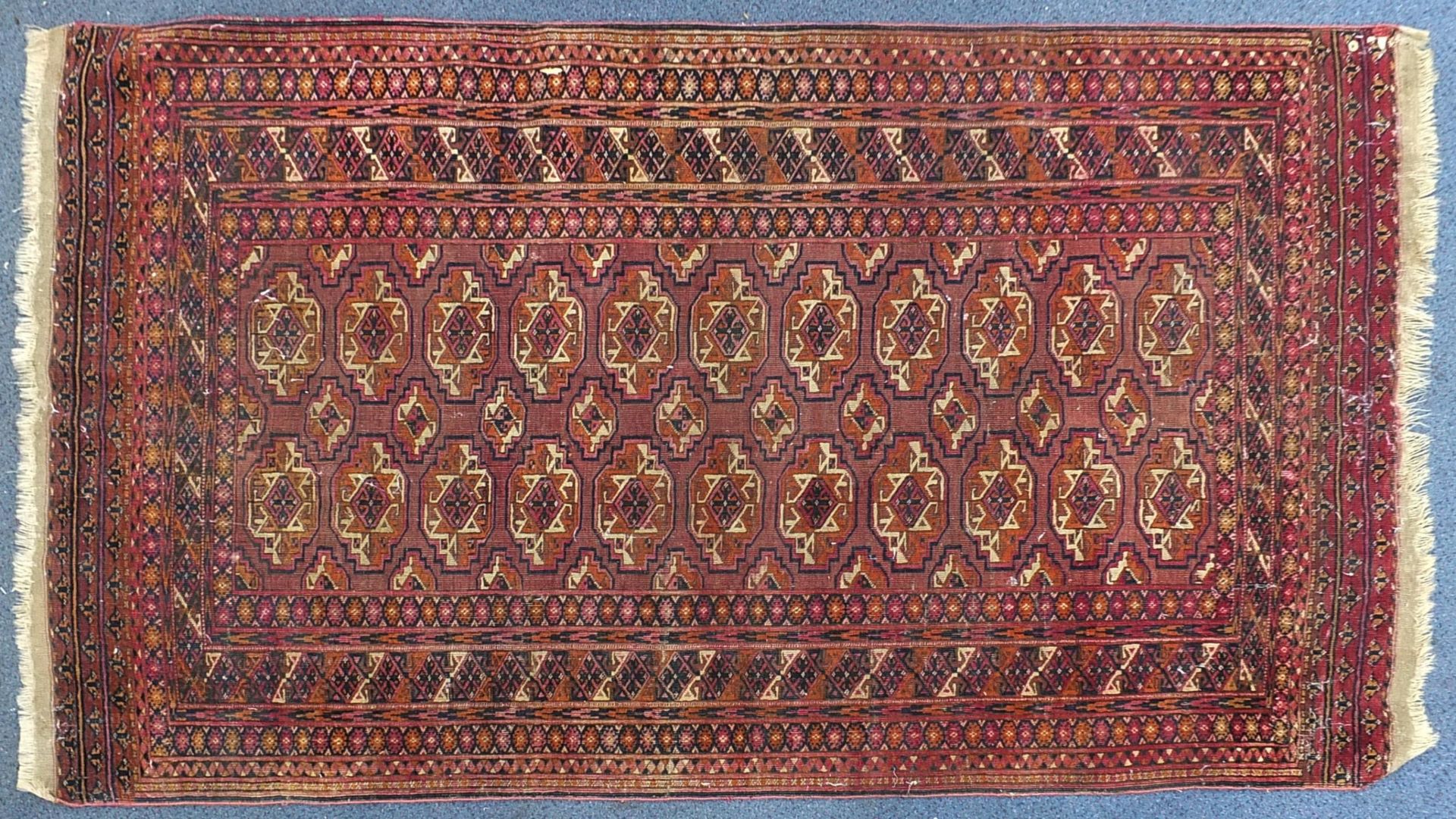 Rectangular Bokhara pink ground rug having an all over geometric design, 190cm x 104cm : For further