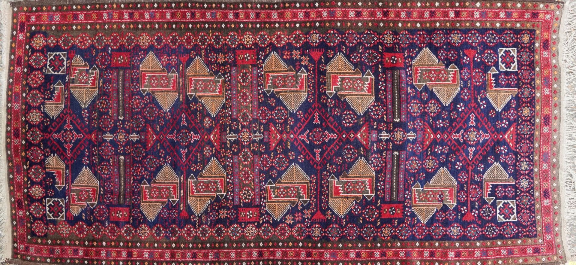 Rectangular Persian rug having an allover repeat geometric design, 230cm x 110cm : For further