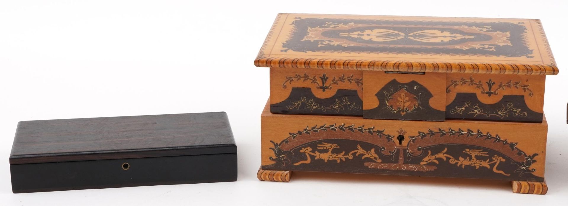 Wooden Sorento ware musical jewellery box, olive wood cantilever sewing box and an ebony box, the - Image 2 of 3
