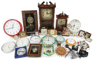 Large collection of clocks including wall clocks, mantle clocks and travel clocks : For further