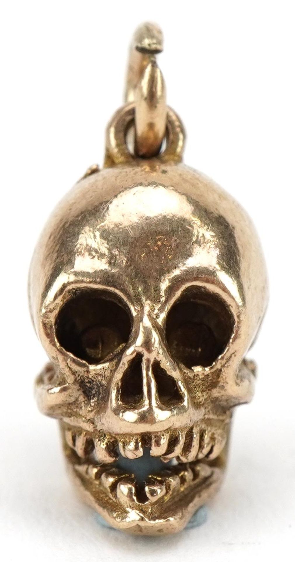 9ct gold human skull charm with articulated jaw, 1.5cm high, 3.2g : For further information on