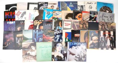 Vinyl LP records including The Beatles, Whitesnake, Genesis, Deaf Leopard, Bob Dylan, Queen and