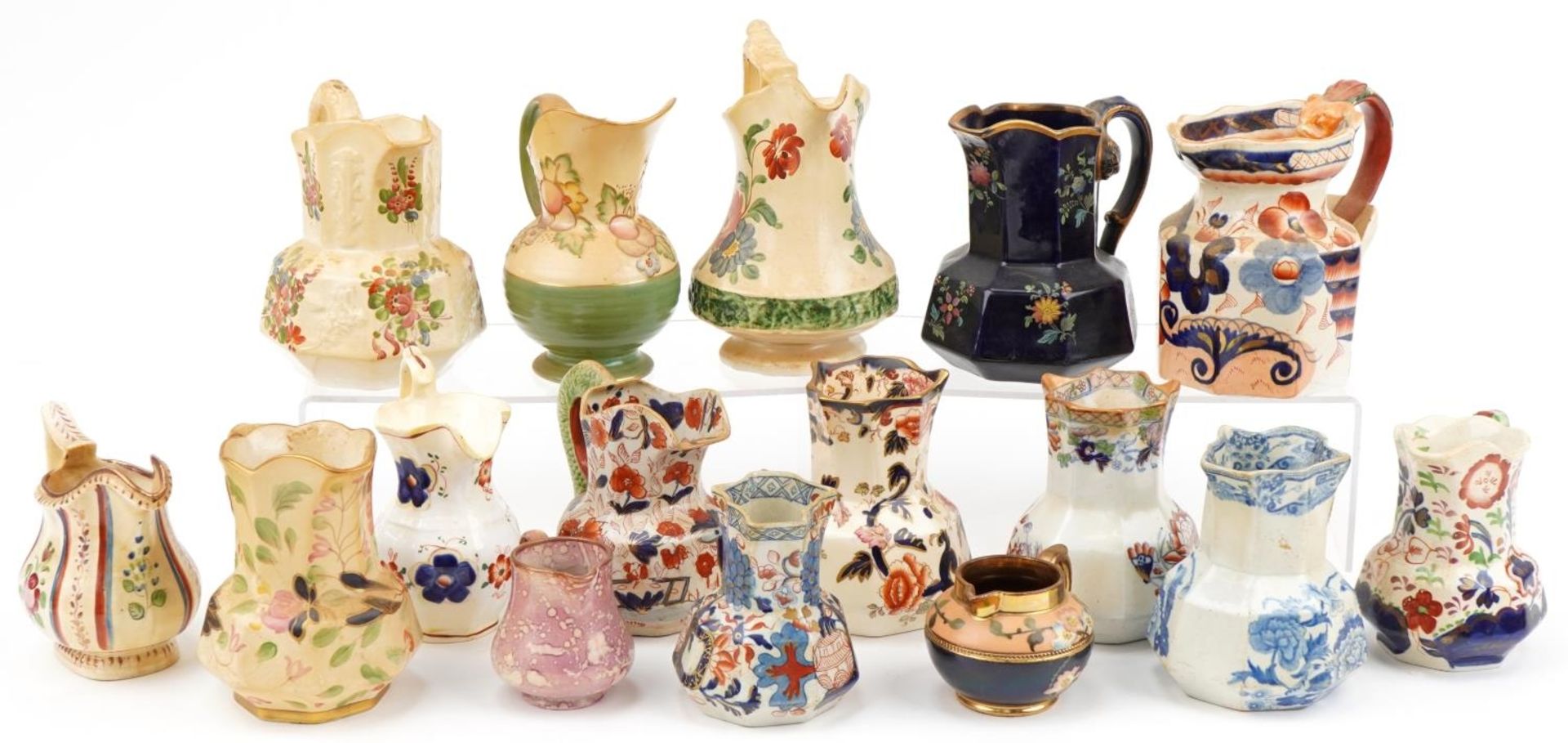 Early 19th century and later jugs including an example hand painted with flowers, cobalt blue glazed