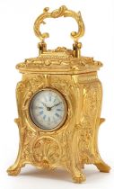 Miniature gilt brass Rococo style carriage clock with swing handle, 10cm high : For further