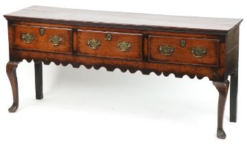 Georgian oak dresser base fitted with three drawers having ornate brass handles, 82cm H x 186cm W