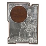 Art Nouveau unmarked silver easel photo frame embossed with a family praying, She taught me to lisp,