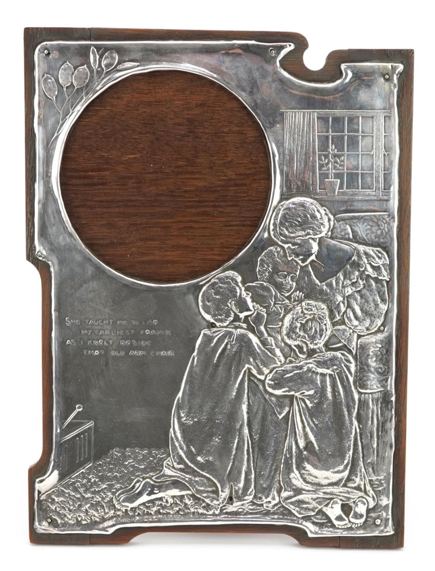 Art Nouveau unmarked silver easel photo frame embossed with a family praying, She taught me to lisp,