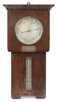 Arts & Crafts oak wall aneroid barometer with thermometer and silver presentation plaque engraved