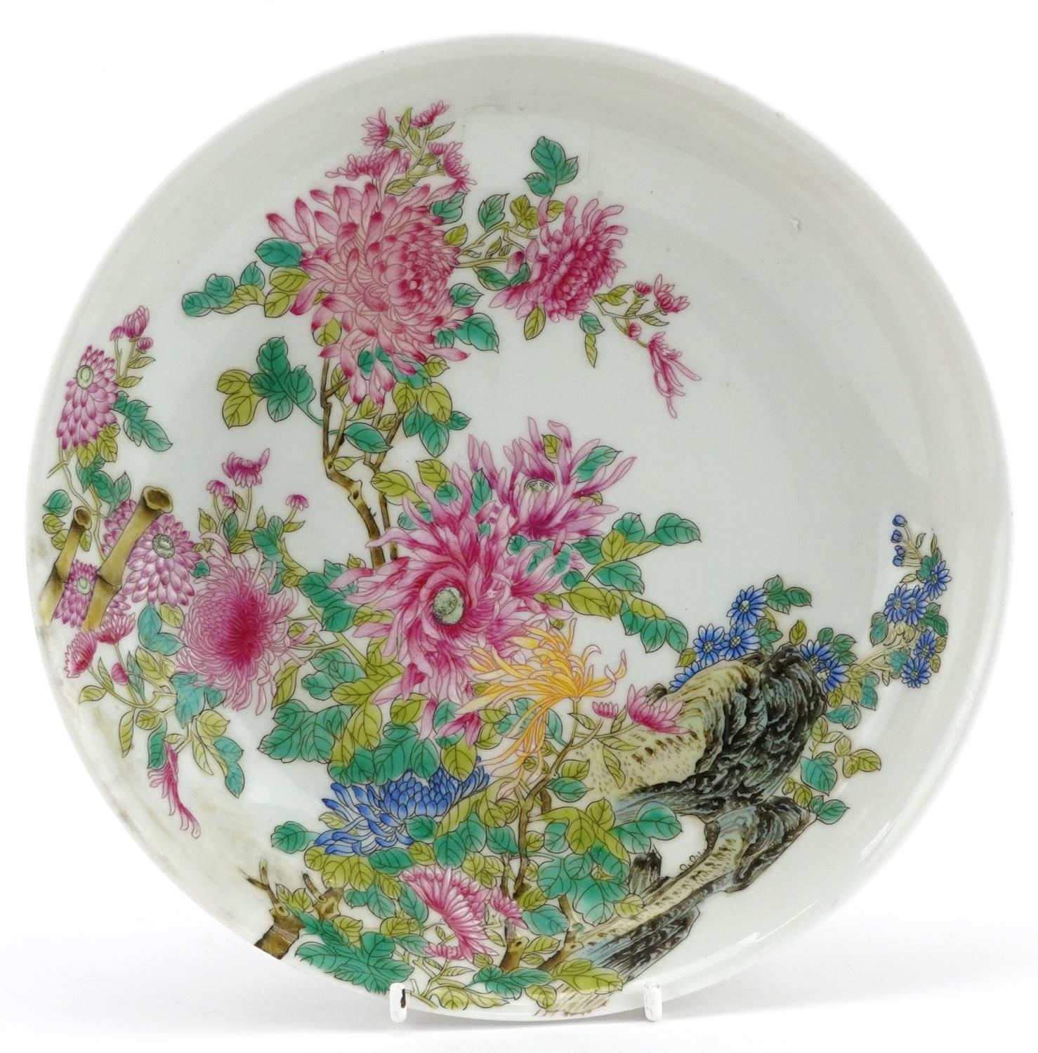 Chinese porcelain shallow dish hand painted in the famille rose palette with flowers, four figure