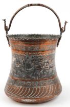 Persian coppered white metal bucket engraved with figures and animals, 38cm high excluding the swing