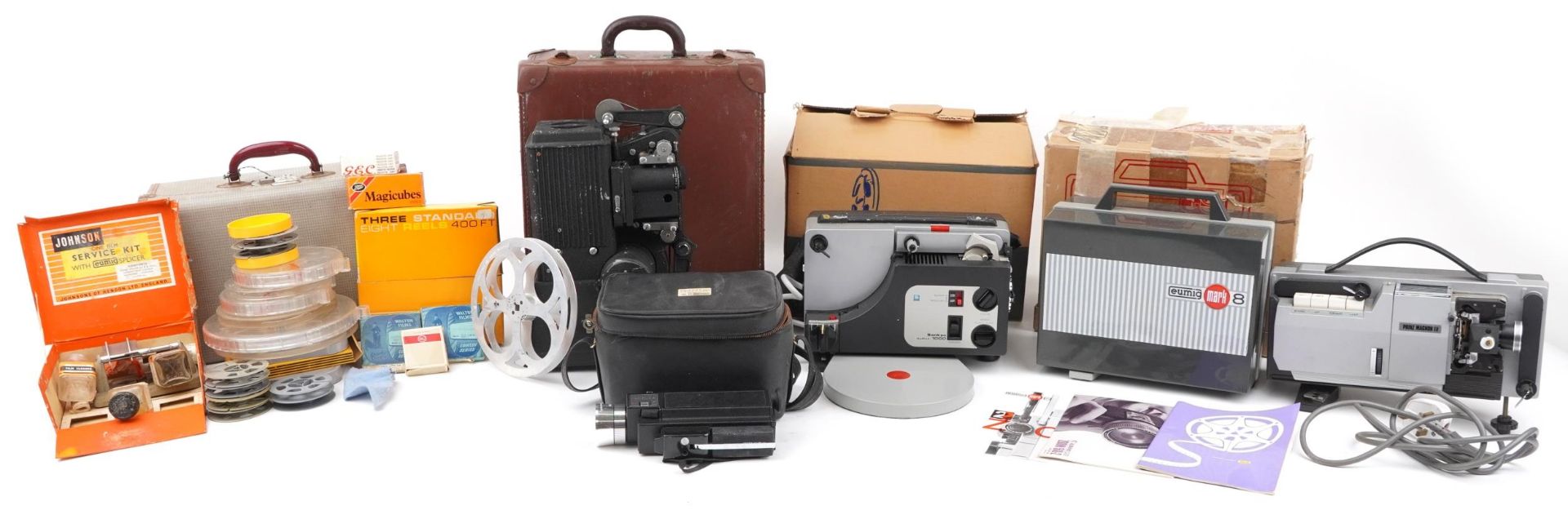 Four vintage film projectors and accessories, some with boxes comprising Eumig MK 8, Sankyo Dualux