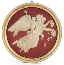 Peter Ipsen, Danish terracotta circular wall plaque decorated in relief with an angel and Putti,
