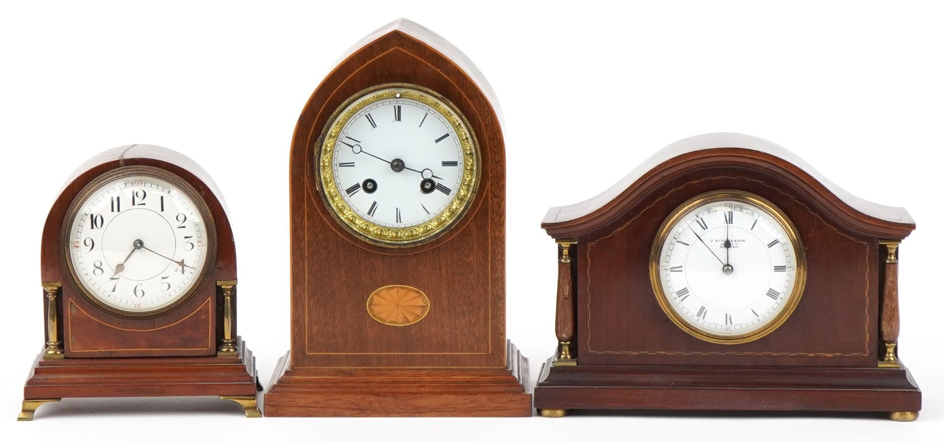 Three Edwardian inlaid mahogany mantle clocks with enamelled dials, the largest 26cm high : For