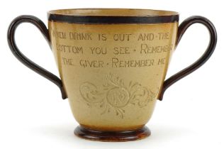 Mark Marshall for Doulton Lambeth, stoneware twin handled loving cup with incised motto When drink
