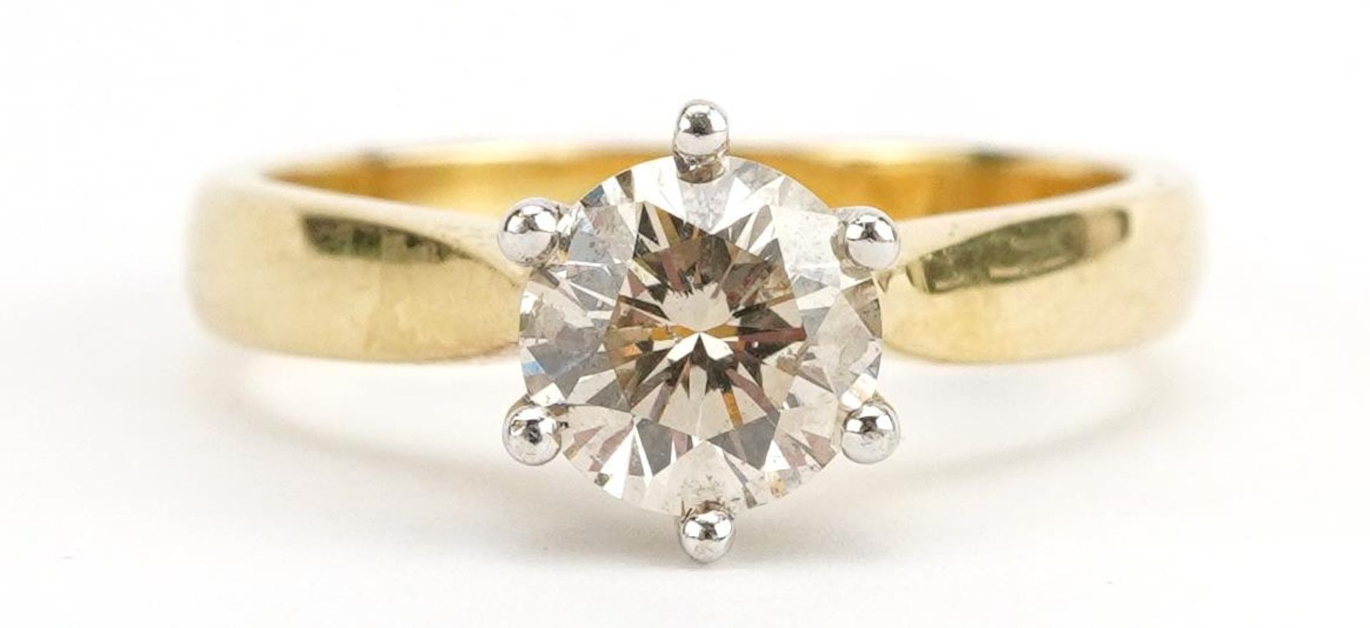 18ct gold diamond solitaire ring housed in a Winegartens tooled leather box, the diamond