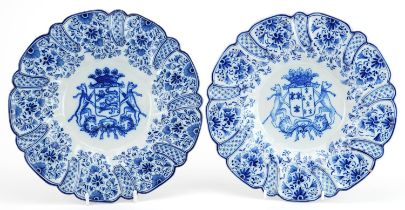 Near pair of antique French faience glazed armorial footed plates hand painted with flowers, each