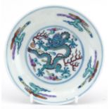 Chinese doucai porcelain dish hand painted with a dragon chasing the flaming pearl amongst clouds,
