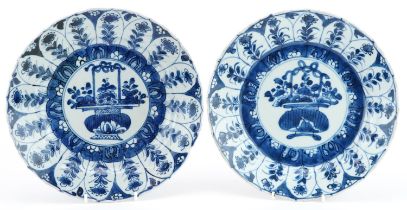 Matched pair of Chinese blue and white porcelain plates hand painted with flowers, one with Nicholas