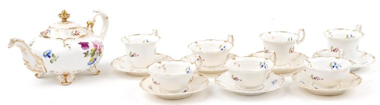 Early Victorian teaware hand painted with flowers including teapot and cups with saucers pattern