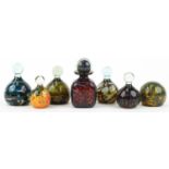 Mdina, Maltese art glass comprising six paperweights and a scent bottle with stopper, the largest