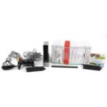 Black Nintendo Wii games console with controllers and a collection of games : For further