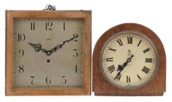 Two oak wall clocks including a George VI GPO electric example with Roman numerals, the largest 31cm