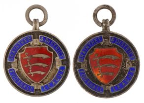 Two silver and enamel Braintree & District Football League sports jewels, 2.8cm in diameter, 30.2g :