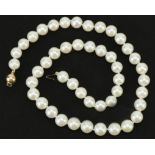Freshwater pearl necklace with 9ct gold clasp, 42cm in length, 43.8g : For further information on