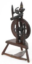 Antique carved oak spinning wheel, 78cm high : For further information on this lot please visit