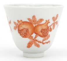 Chinese porcelain tea bowl hand painted in iron red with fruit and flowers, six figure iron red