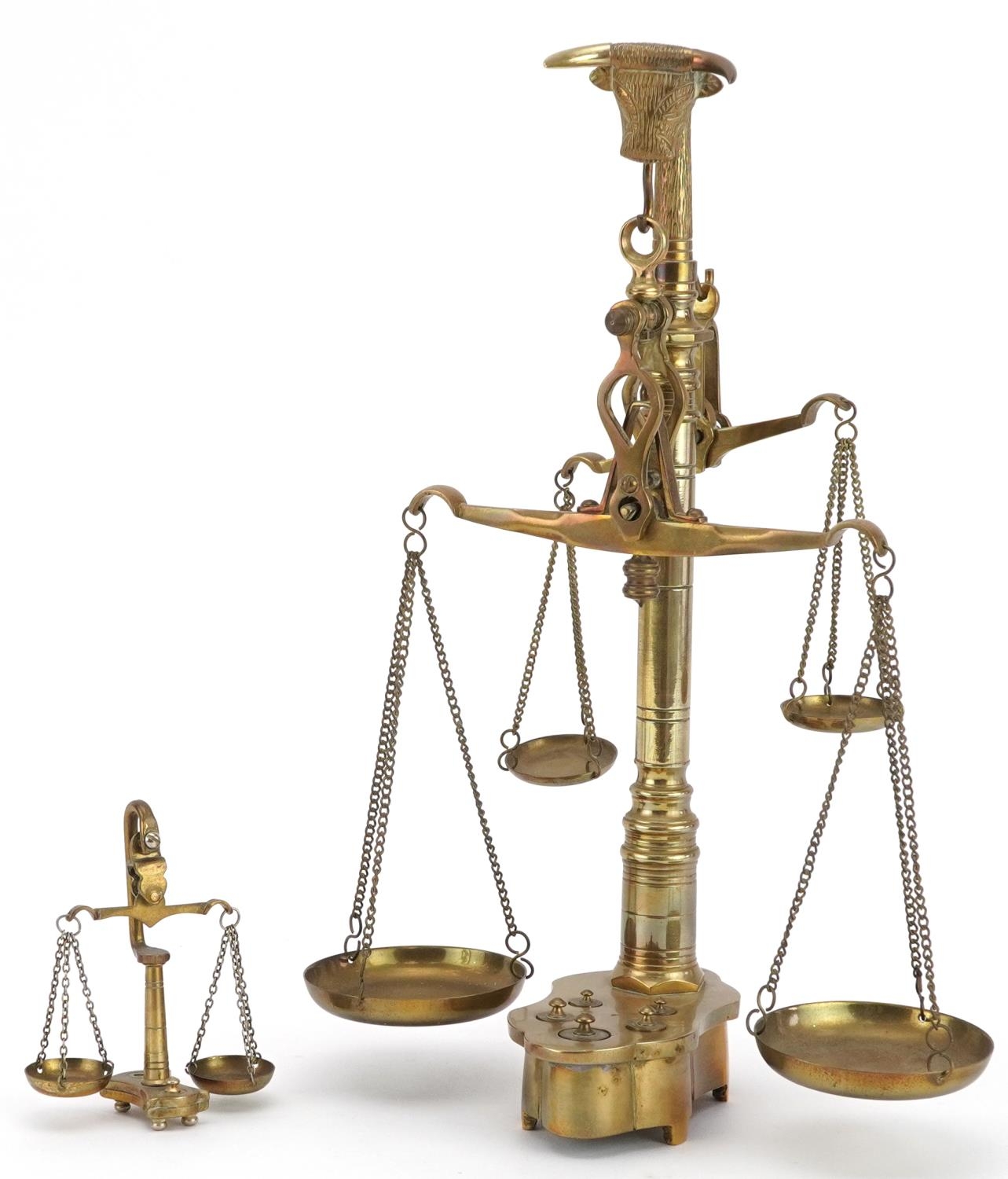 Set of good quality brass ram's head design weighing scales and two others, the largest 31cm