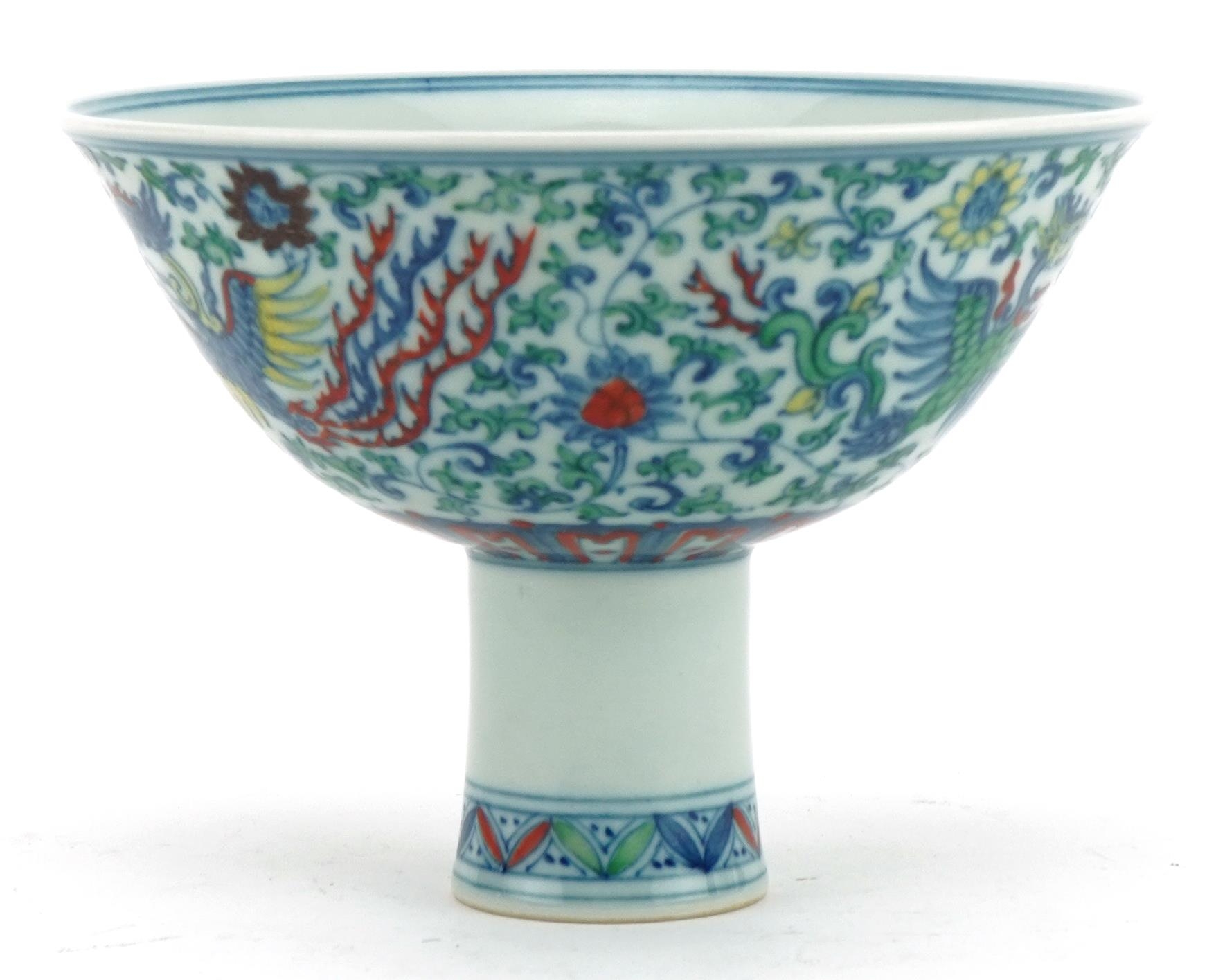 Chinese doucai porcelain stem bowl hand painted with phoenixes amongst flowers, six figure character